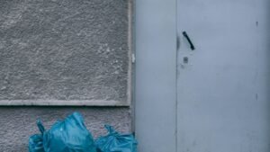 A white door with bags next to it
