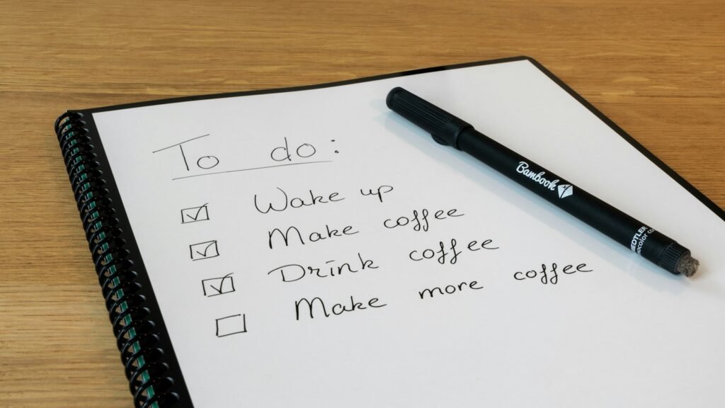 A notepad with a pen