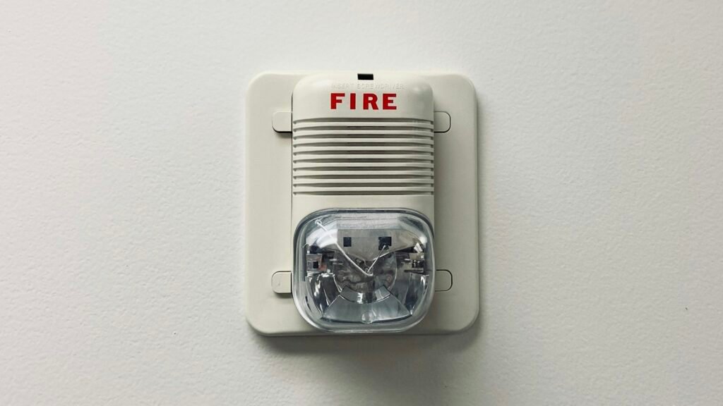 White smoke detector mounted on a wall