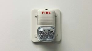 White smoke detector mounted on a wall
