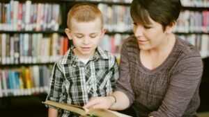 A woman and a child reading a book together